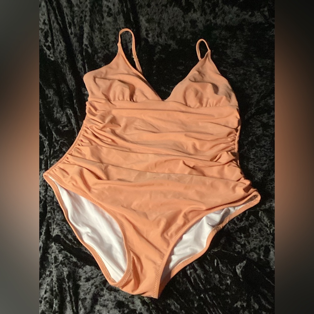 One peice women’s bathing suit tan/orange size L